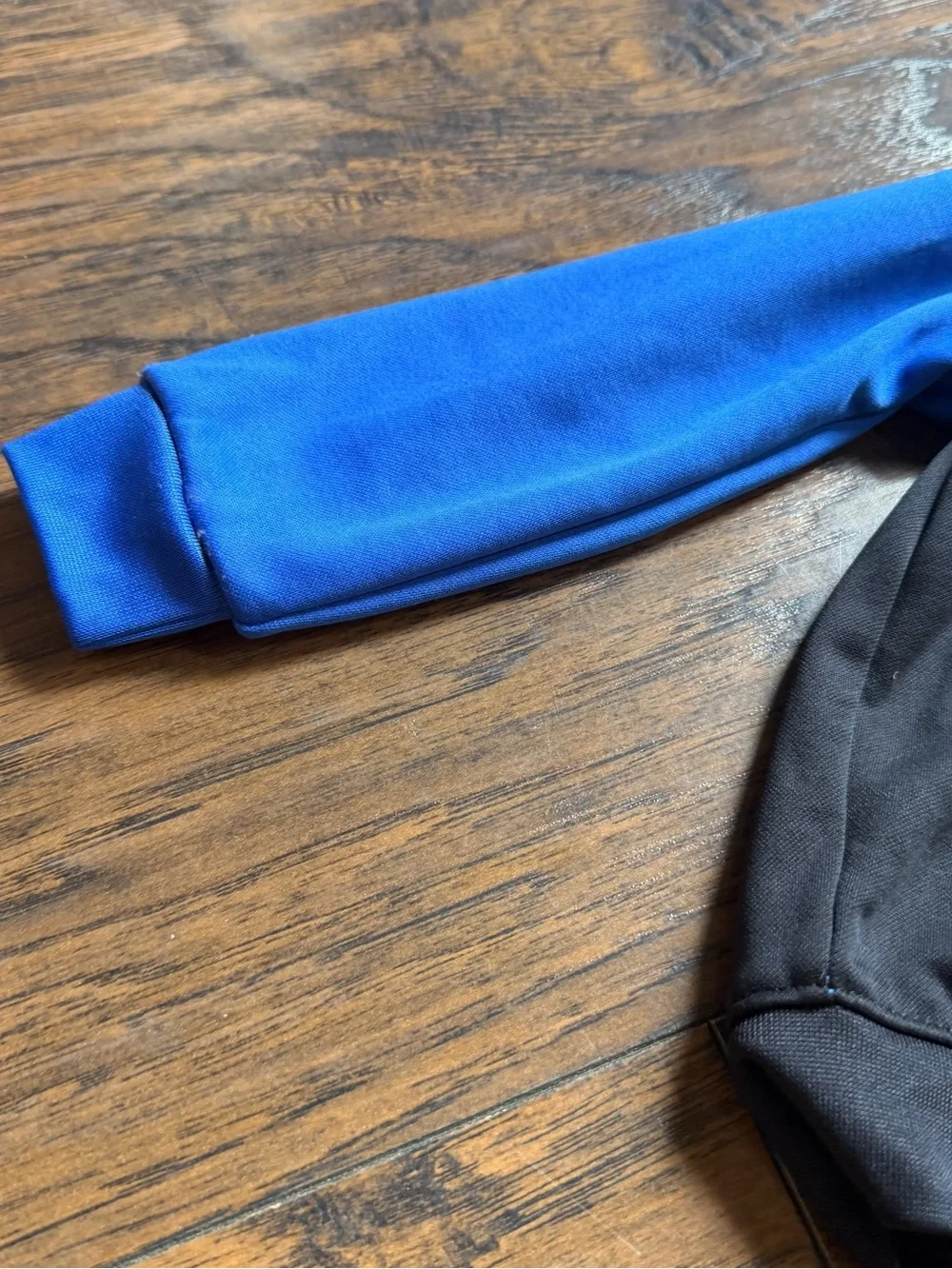 Nike Black Hoodie with Blue Sleeves and White Logo